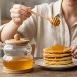 Glass Honey Dispenser with Wooden Lid, Dipper and Base - Image 3